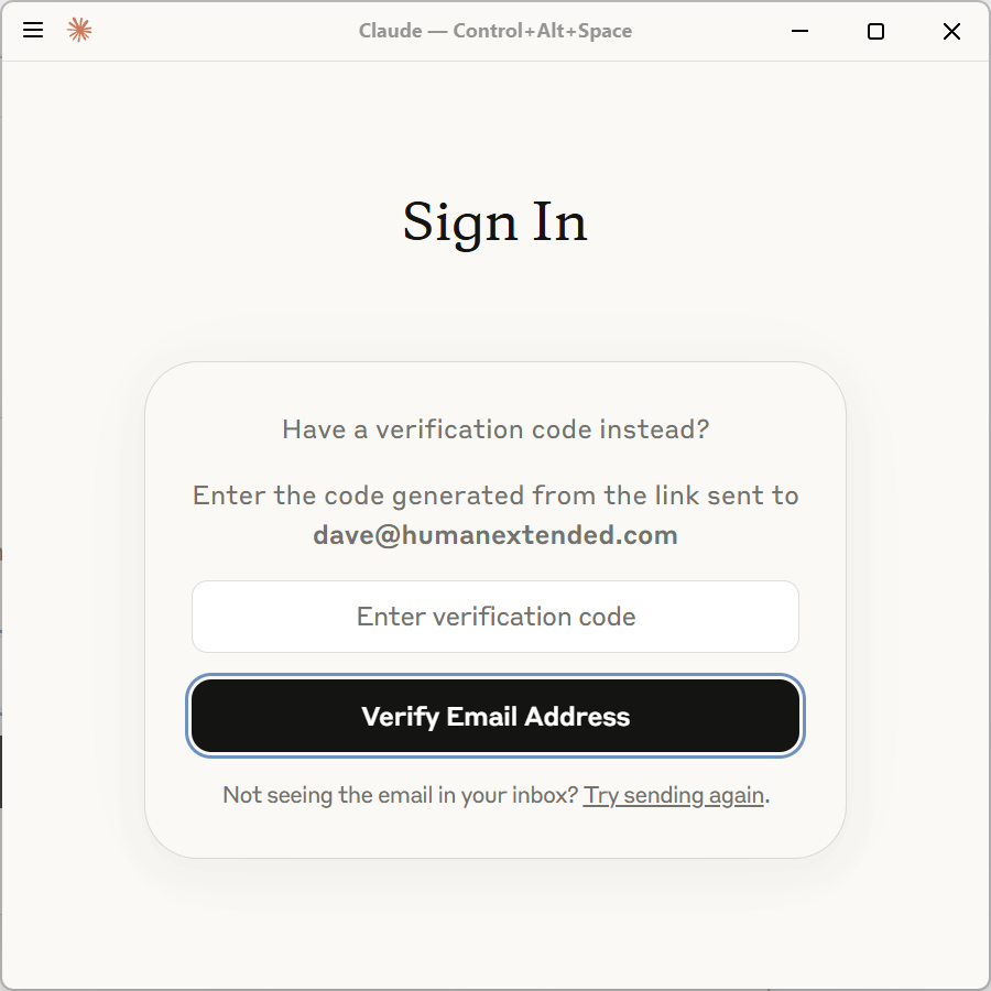 Screen of Claude Desktop when being prompted to enter a verification code sent to the login email address. The screen has a text box with "Enter Verification Code" and a button with "Verify Email Address"
